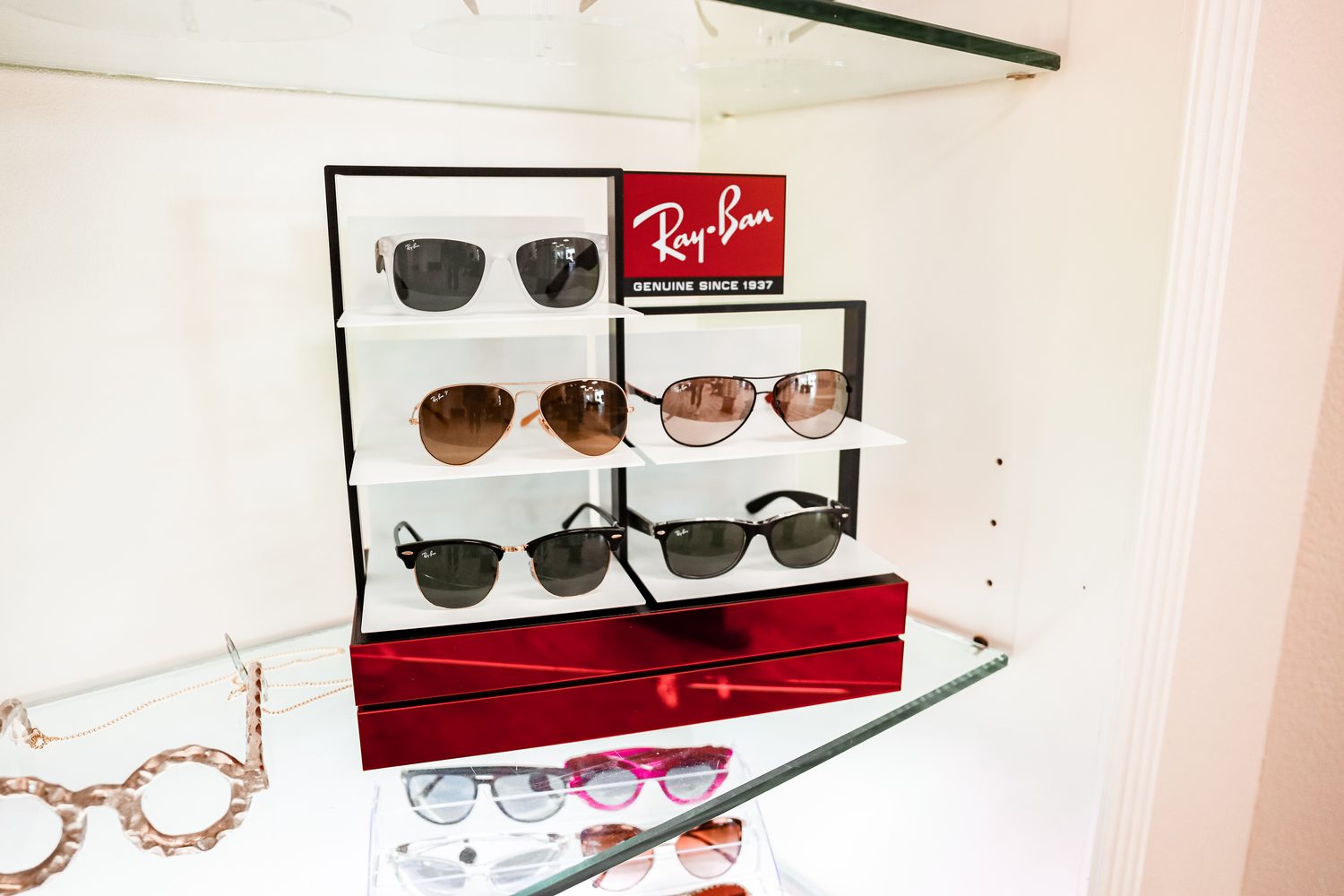 Sunglasses display wall at Eye Koni Optical featuring designer and lifestyle eyewear